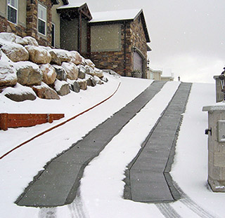 Heated tire tracks in driveway.